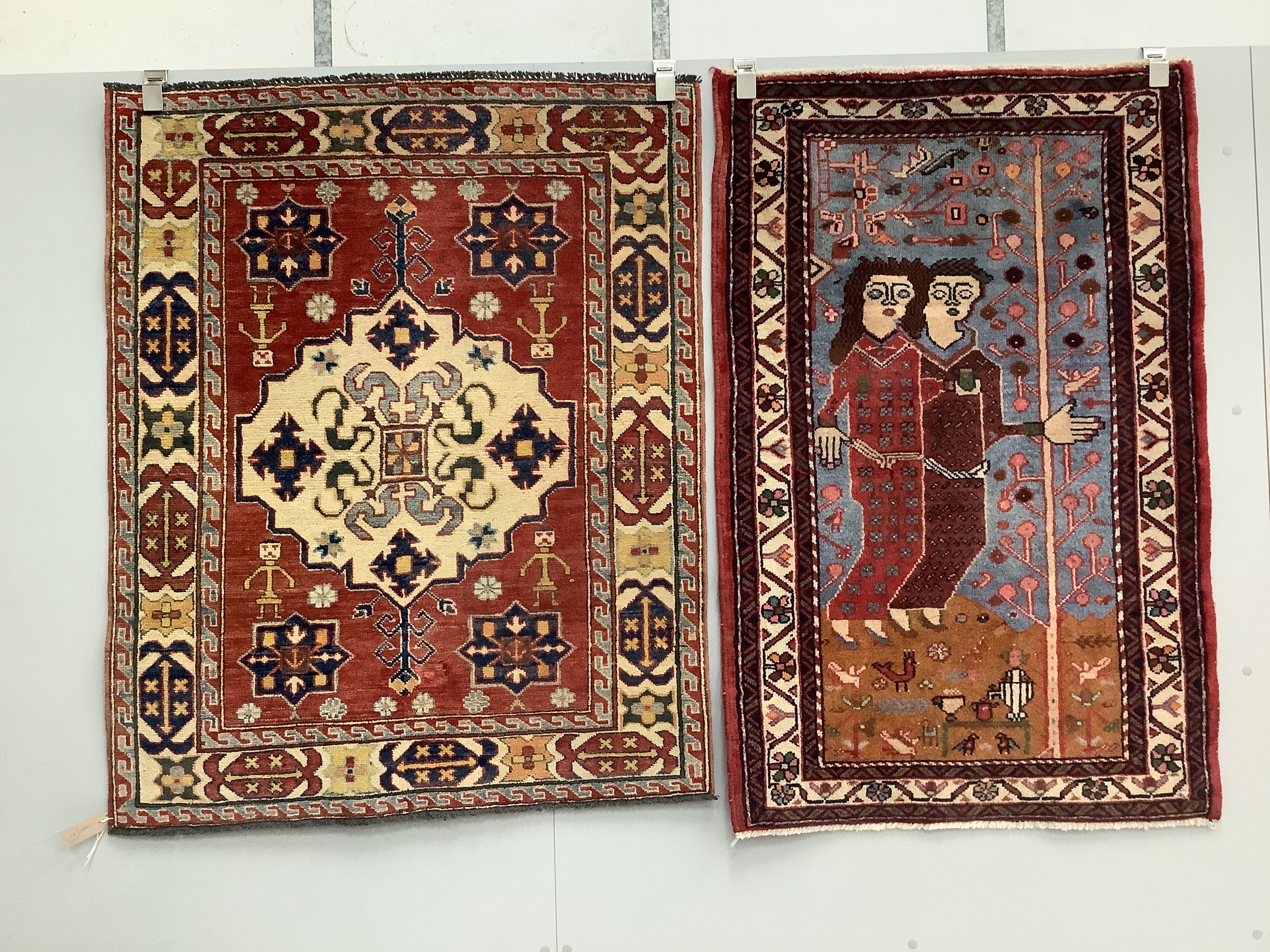 A Caucasian style red ground rug, a North West Persian figural rug, an antique Shirvan rug and one other rug (4), largest 121 x 99cm